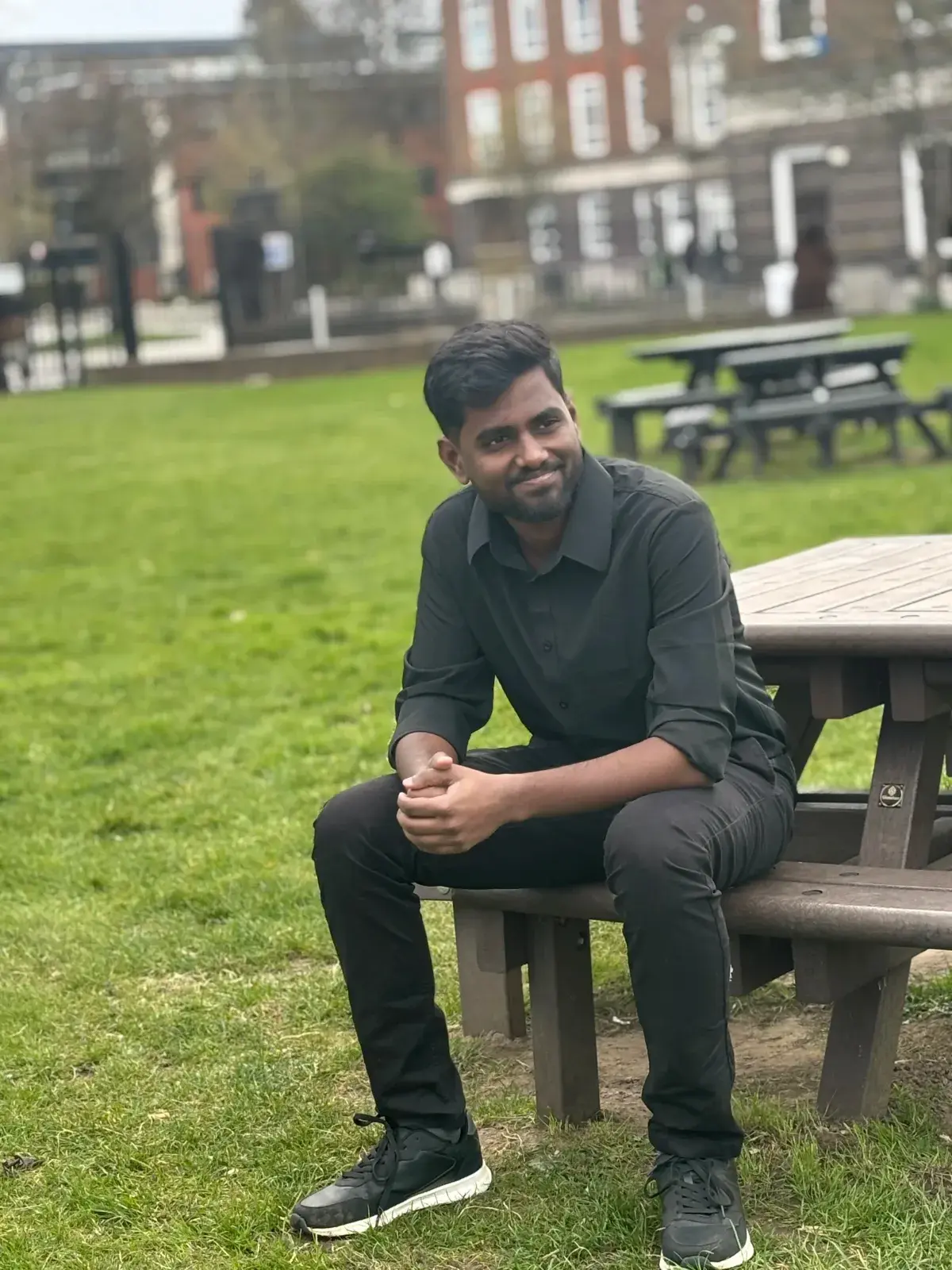 Krishnakumar sitting in a park during his years of learning by building